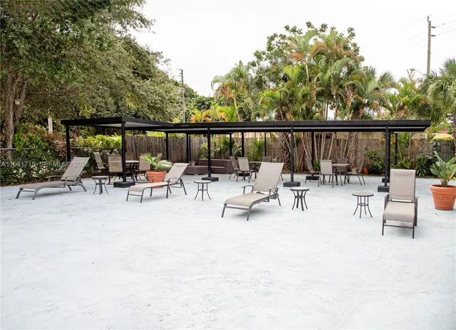 a view of backyard with a patio and outdoor seating