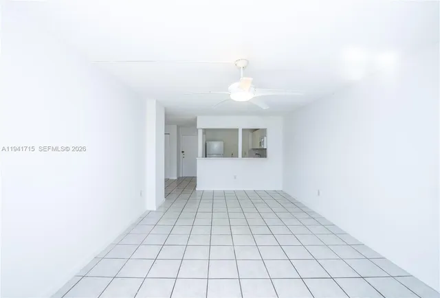 a view of an empty room and window