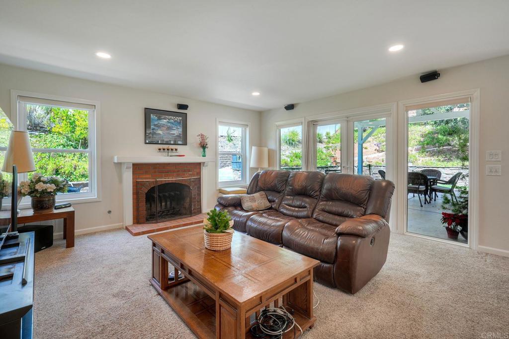 13639 Freeport Road San Diego, CA 92129 - Photo 10 of 44 a living room with furniture and a fireplace