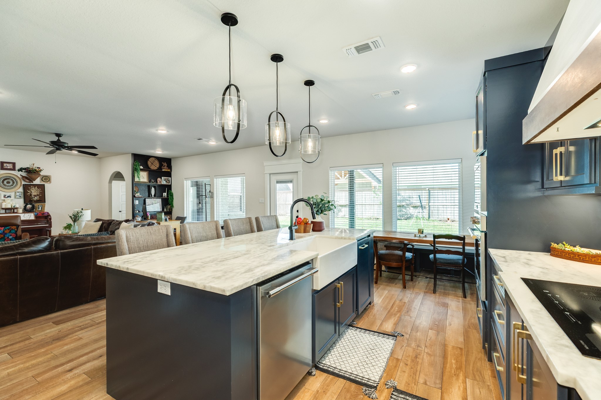 2 Greystone Court Angleton, TX 77515 - Photo 17 of 34 a kitchen with counter space appliances and a ceiling fan