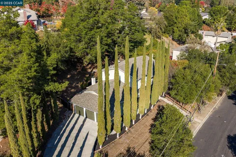 a view of a building with brick wall and plants
