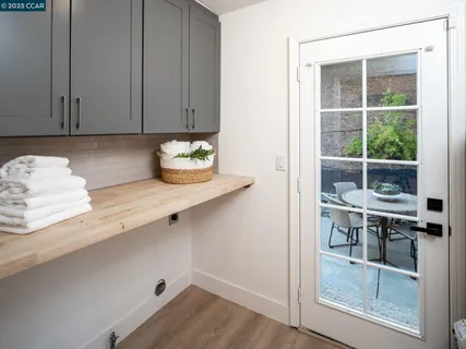 a backyard of a house with fire pit and chairs