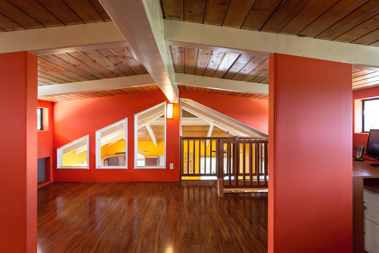 890 East Kuiaha Road Haiku, HI 96708 - Photo 19 of 30 a view of an empty room with wooden floor and a window