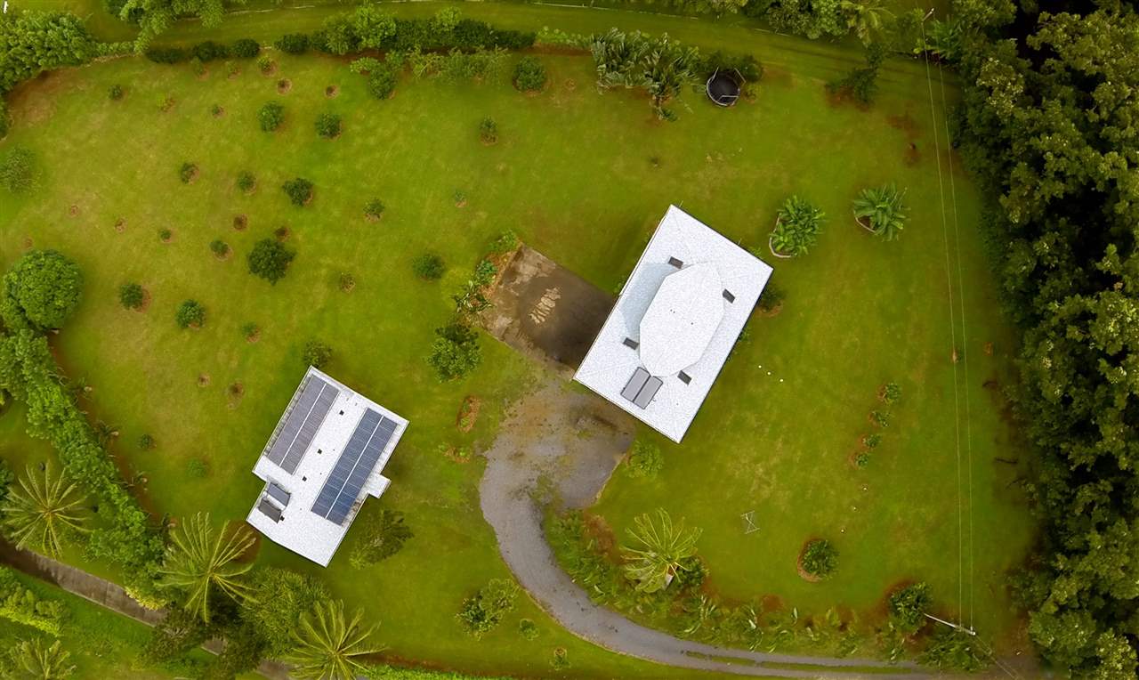 890 East Kuiaha Road Haiku, HI 96708 - Photo 9 of 30 an aerial view of a house with a swimming pool