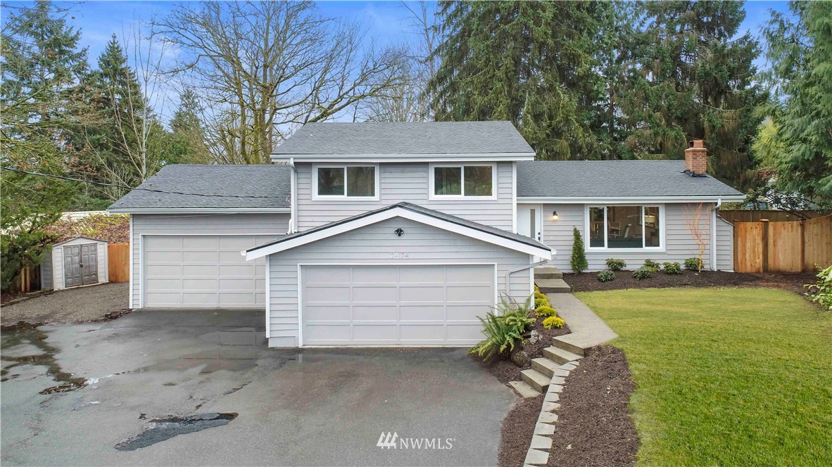 24174 Brier Road Brier, WA 98036 - Photo 2 of 27 a front view of a house with a yard and garage