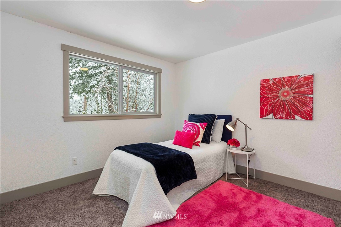 24174 Brier Road Brier, WA 98036 - Photo 17 of 27 a bedroom with a bed and a window