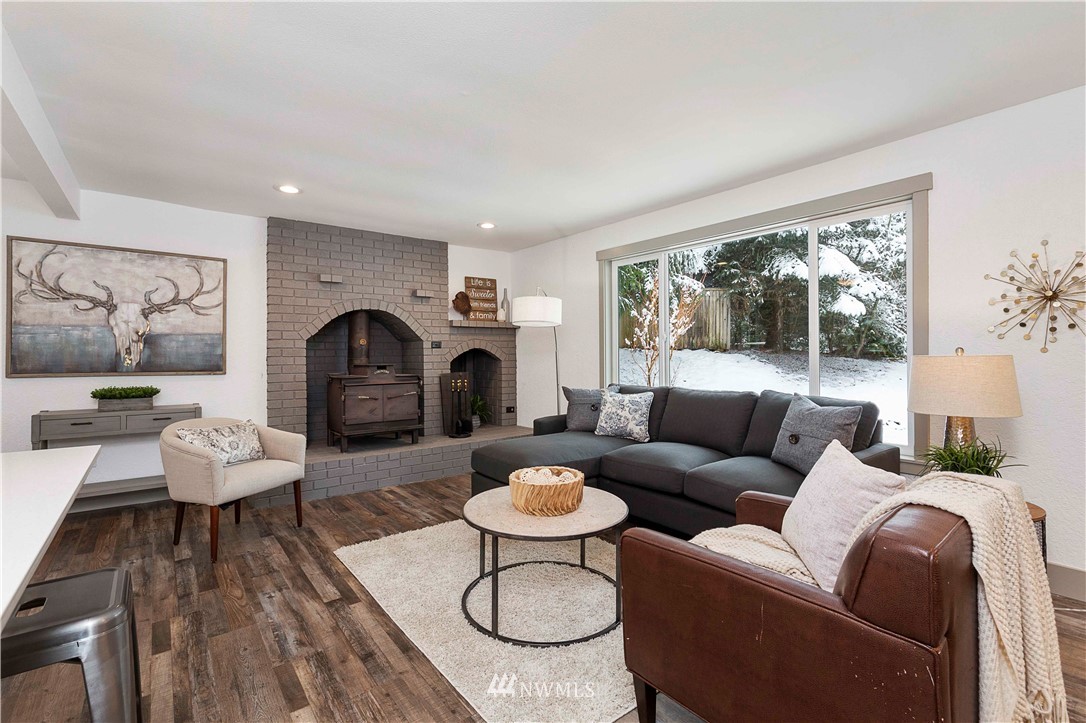 24174 Brier Road Brier, WA 98036 - Photo 5 of 27 a living room with furniture and a fireplace