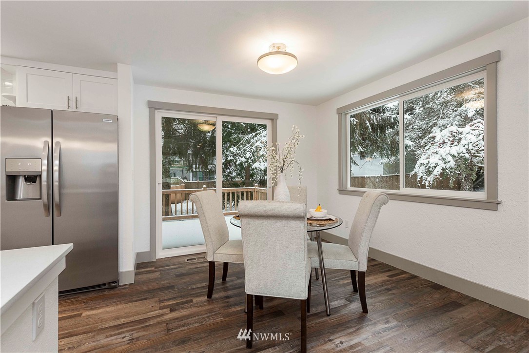 24174 Brier Road Brier, WA 98036 - Photo 10 of 27 a view of a dining room with furniture window and wooden floor
