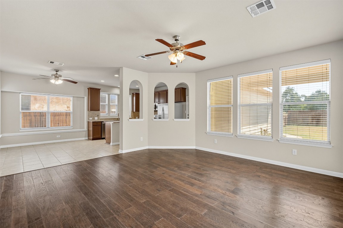 111 Sycamore Street Georgetown, TX 78633 - Photo 19 of 22 a view of an empty room with a window and wooden floor