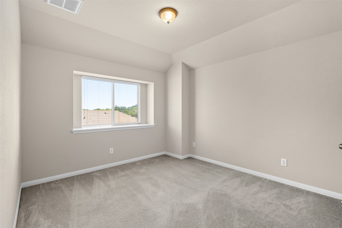 111 Sycamore Street Georgetown, TX 78633 - Photo 13 of 22 an empty room with windows and closet