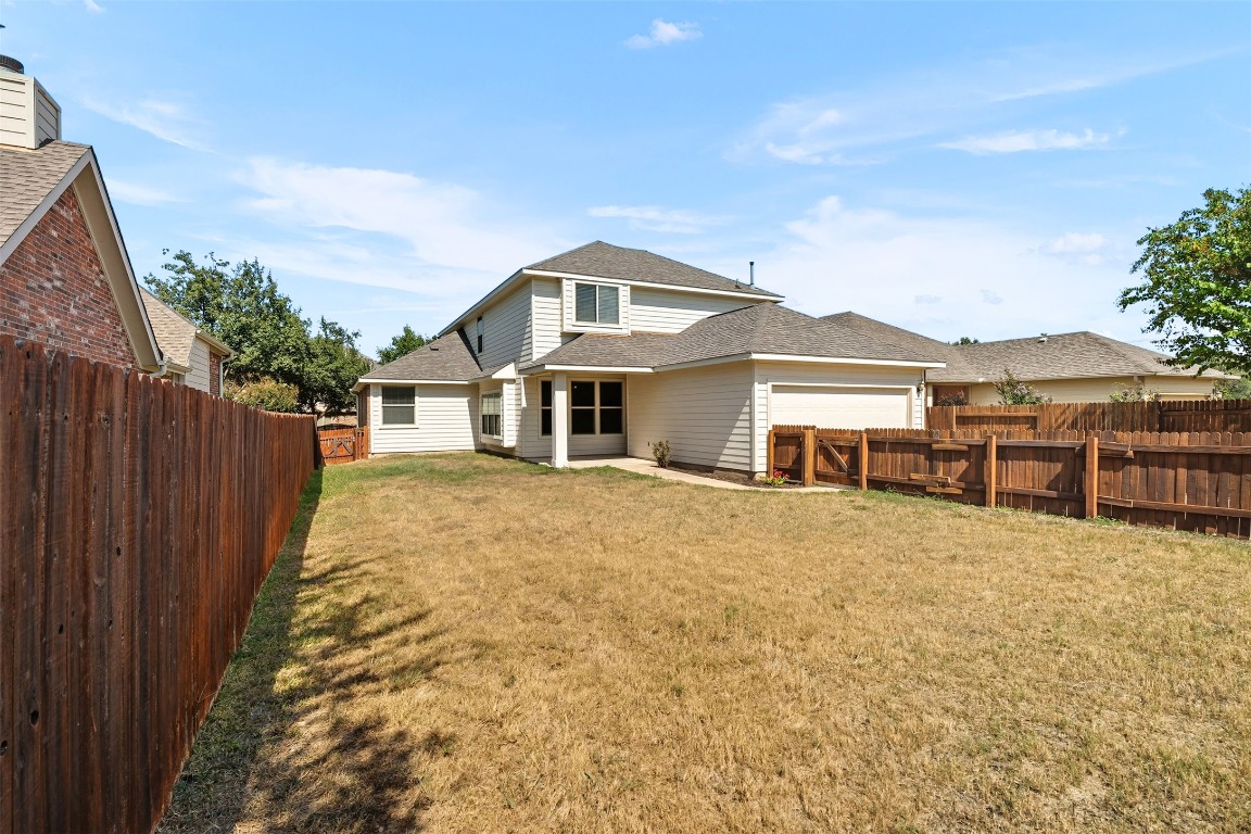 111 Sycamore Street Georgetown, TX 78633 - Photo 18 of 22 a front view of a house with a yard and garage