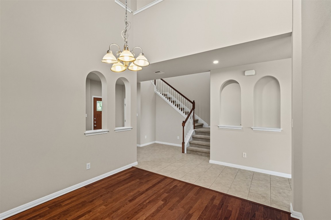 111 Sycamore Street Georgetown, TX 78633 - Photo 5 of 22 a view of a room with wooden floor chandelier and entryway