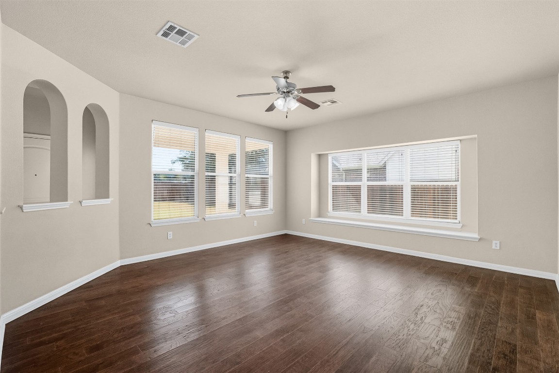 111 Sycamore Street Georgetown, TX 78633 - Photo 20 of 22 a view of an empty room with wooden floor and a window