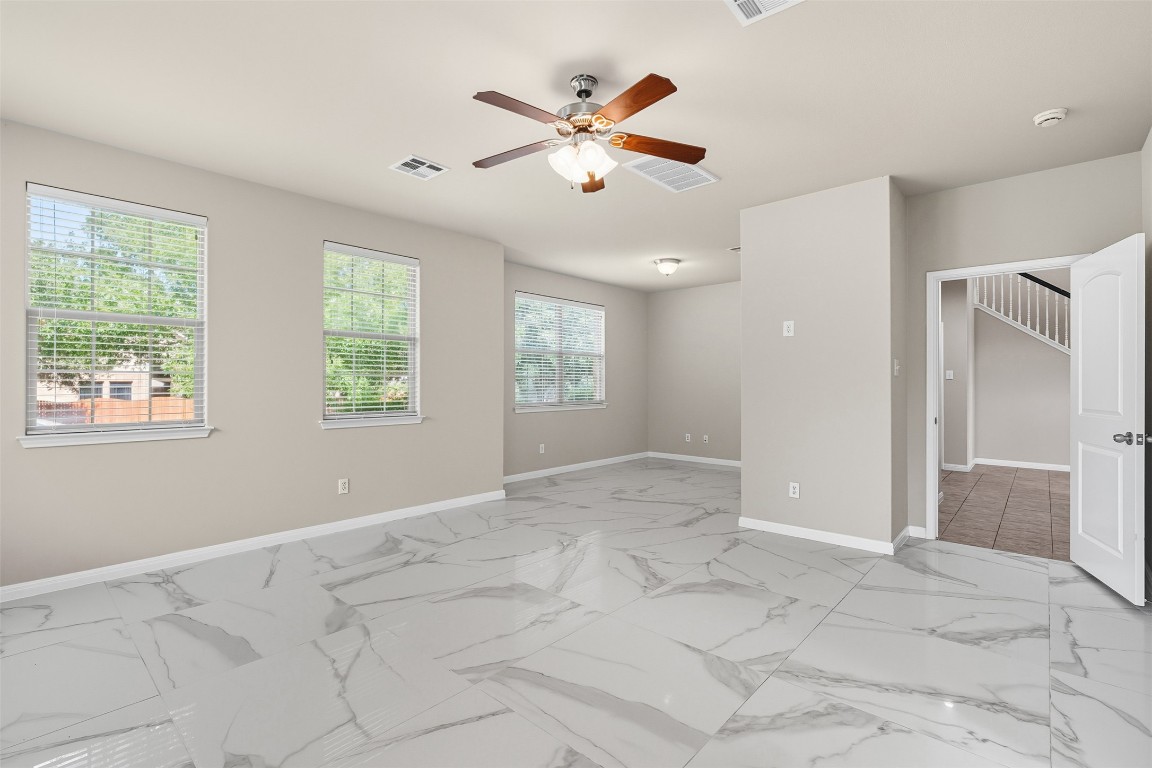 111 Sycamore Street Georgetown, TX 78633 - Photo 8 of 22 a view of an empty room with window and cabinet