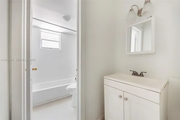 a bathroom with a bathtub and a toilet