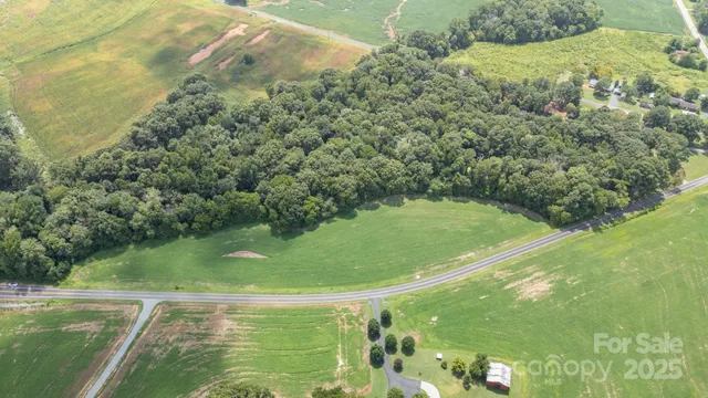 a view of a swimming pool with a yard