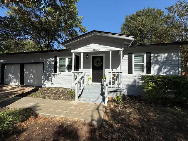 a front view of a house with a patio