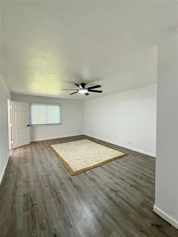 an empty room with wooden floor