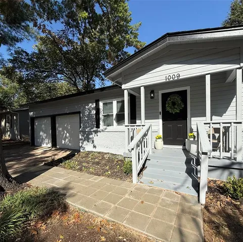 a front view of a house with a outdoor space