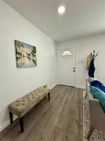 a bedroom with bed and a window