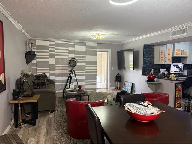 a living room with furniture and decor