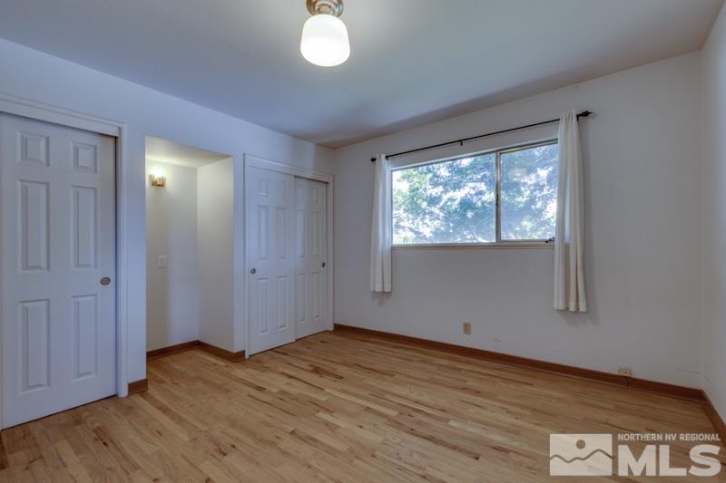 1990 Marlette Avenue Reno, NV 89503 - Photo 14 of 21 a view of empty room with wooden floor and fan