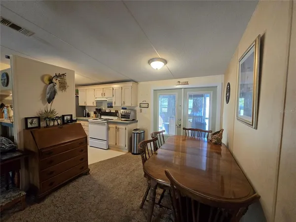a dining room with furniture and window