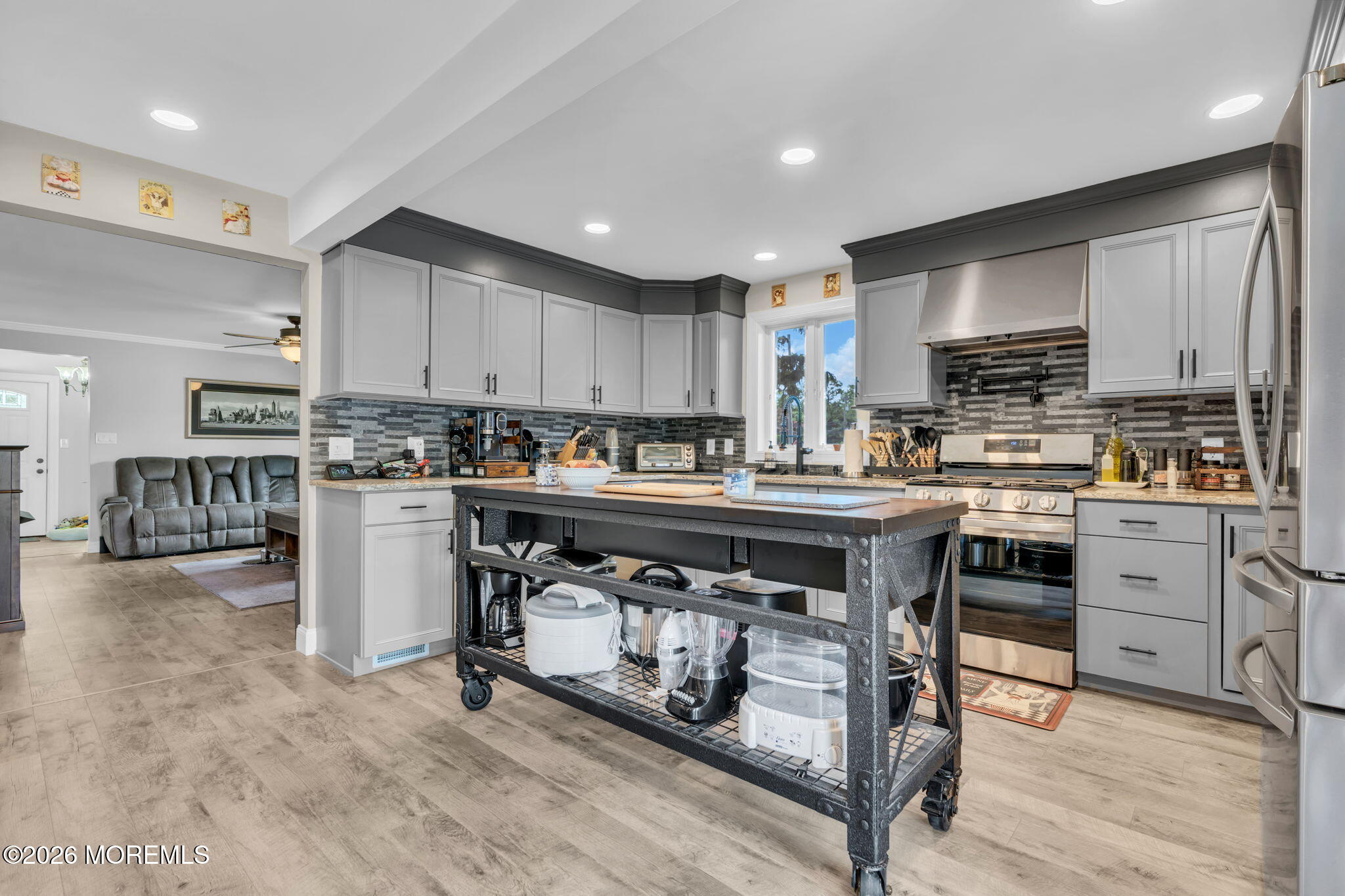 181 Locust Avenue Howell, NJ 07731 - Photo 24 of 66 a kitchen with stainless steel appliances granite countertop a stove top oven a sink a stove a refrigerator and cabinets