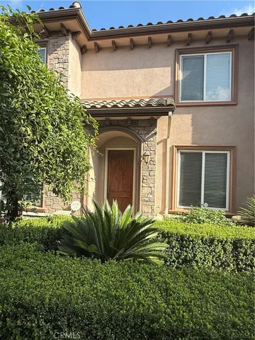 front view of a house with a small yard