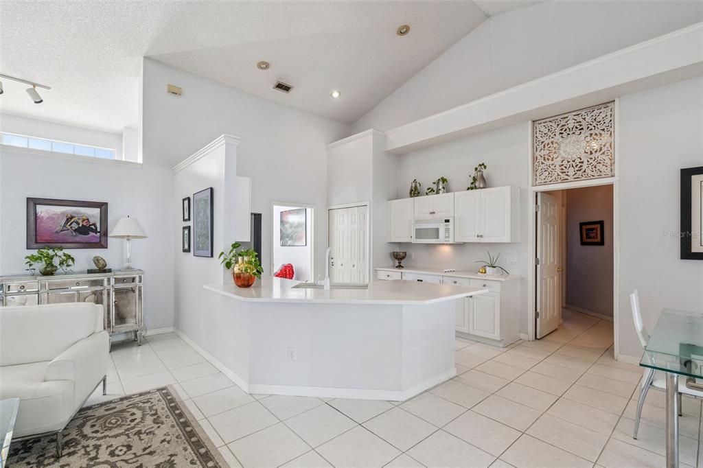 3447 Amaca Circle Orlando, FL 32837 - Photo 13 of 30 a room with a white cabinets and white appliances