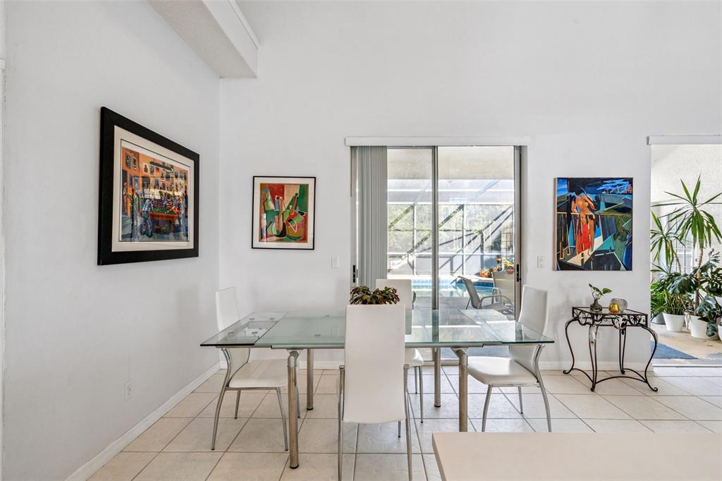 3447 Amaca Circle Orlando, FL 32837 - Photo 15 of 30 a dining room with furniture and large window