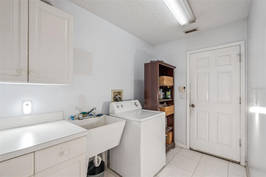 3447 Amaca Circle Orlando, FL 32837 - Photo 25 of 30 a room with storage and utility
