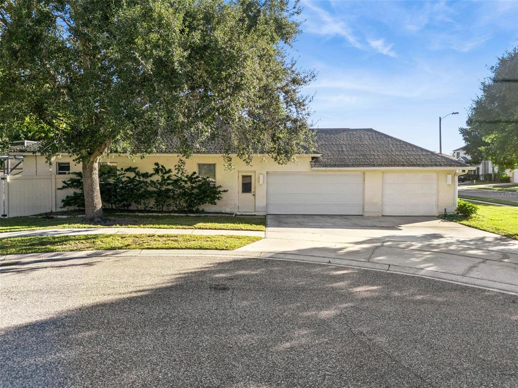 3447 Amaca Circle Orlando, FL 32837 - Photo 3 of 30 a view of a house with a swimming pool and a yard