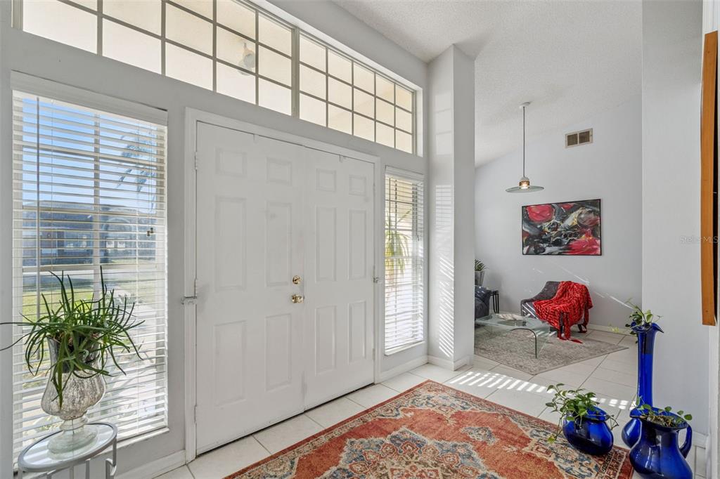 3447 Amaca Circle Orlando, FL 32837 - Photo 4 of 30 wooden floor with white walls and a potted plant
