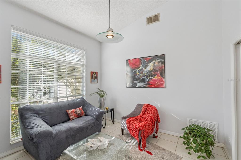 3447 Amaca Circle Orlando, FL 32837 - Photo 5 of 30 a living room with furniture and a large window