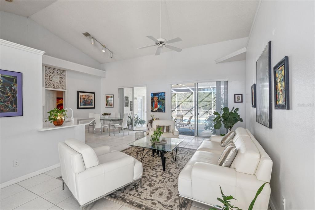 3447 Amaca Circle Orlando, FL 32837 - Photo 9 of 30 a living room with furniture and a large window