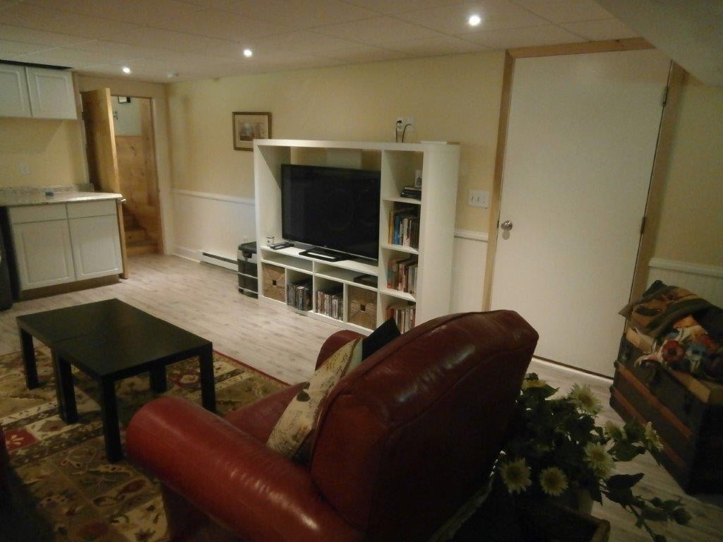 250 Hardwick Road Barre, MA 01005 - Photo 16 of 30 a living room with furniture and a flat screen tv