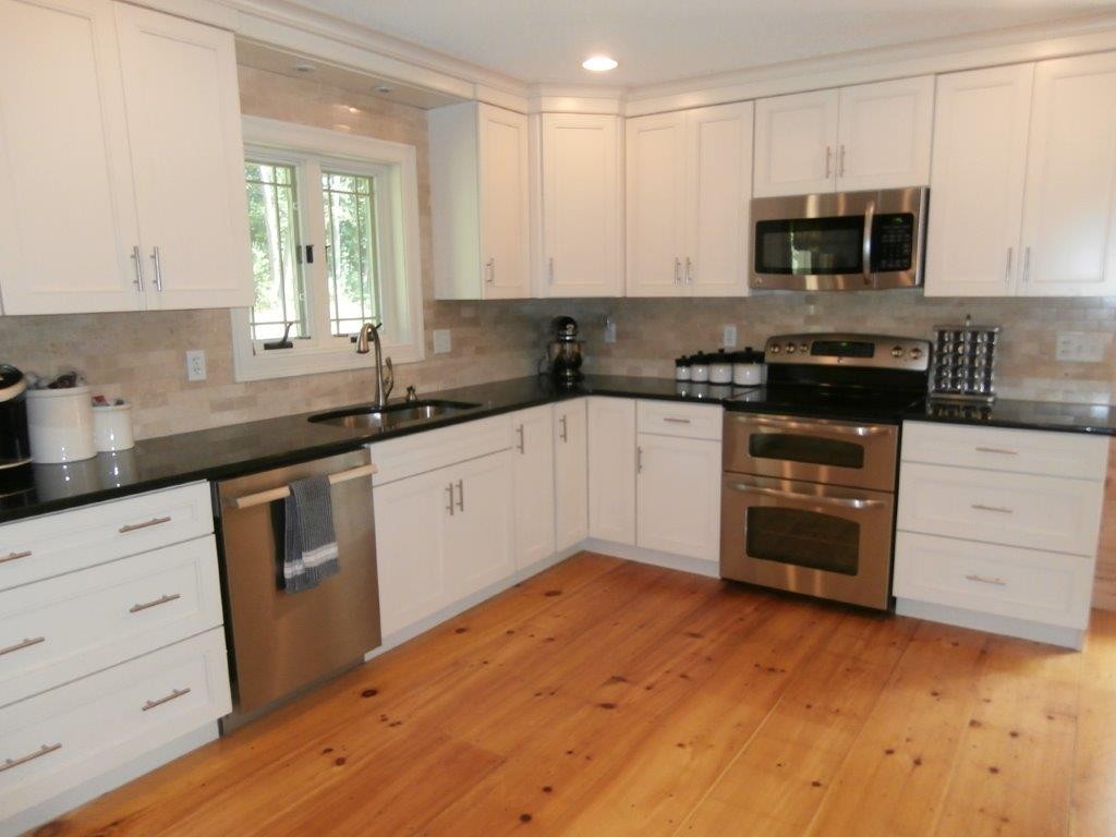 250 Hardwick Road Barre, MA 01005 - Photo 8 of 30 a kitchen with a sink stove and cabinets