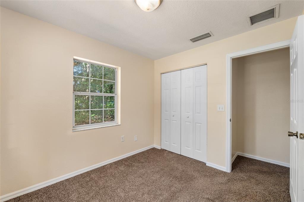 4329 Northwest 155th Street Reddick, FL 32686 - Photo 35 of 52 an empty room with windows