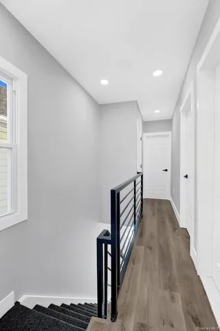 a view of entryway with wooden floor