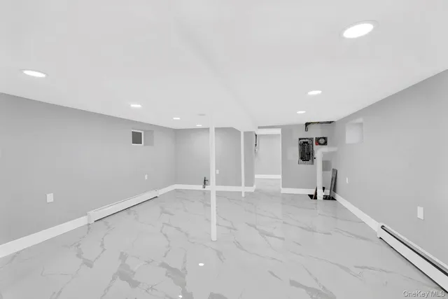 an empty room with a empty space and windows