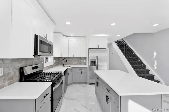 a kitchen with a sink stove and refrigerator