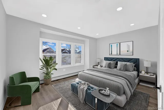 a bedroom with a bed and a couch