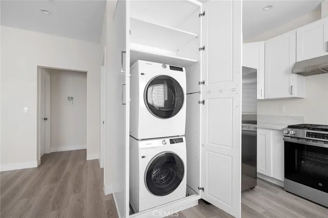 a utility room with sink dryer and washer