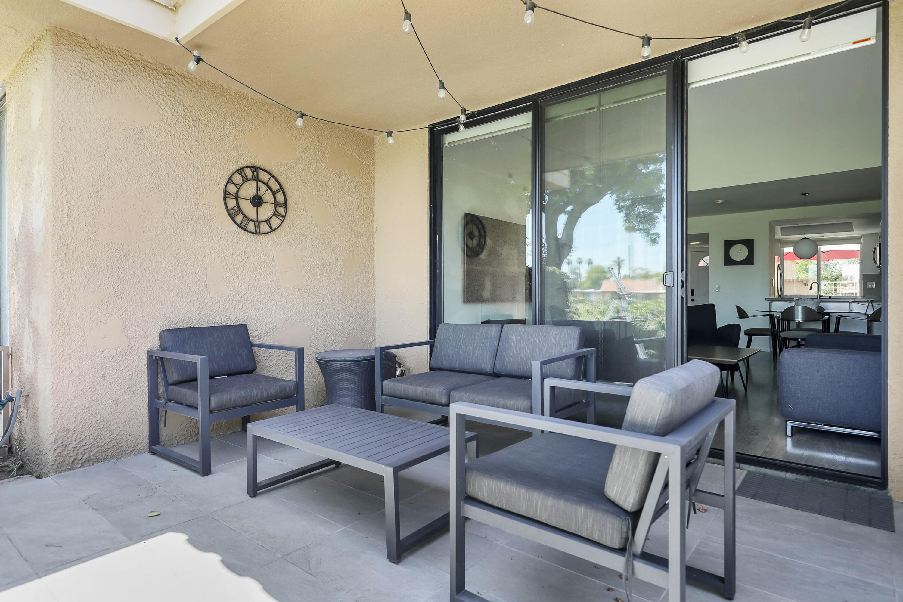 23 Haig Drive Rancho Mirage, CA 92270 - Photo 20 of 49 a living room with furniture and a large window