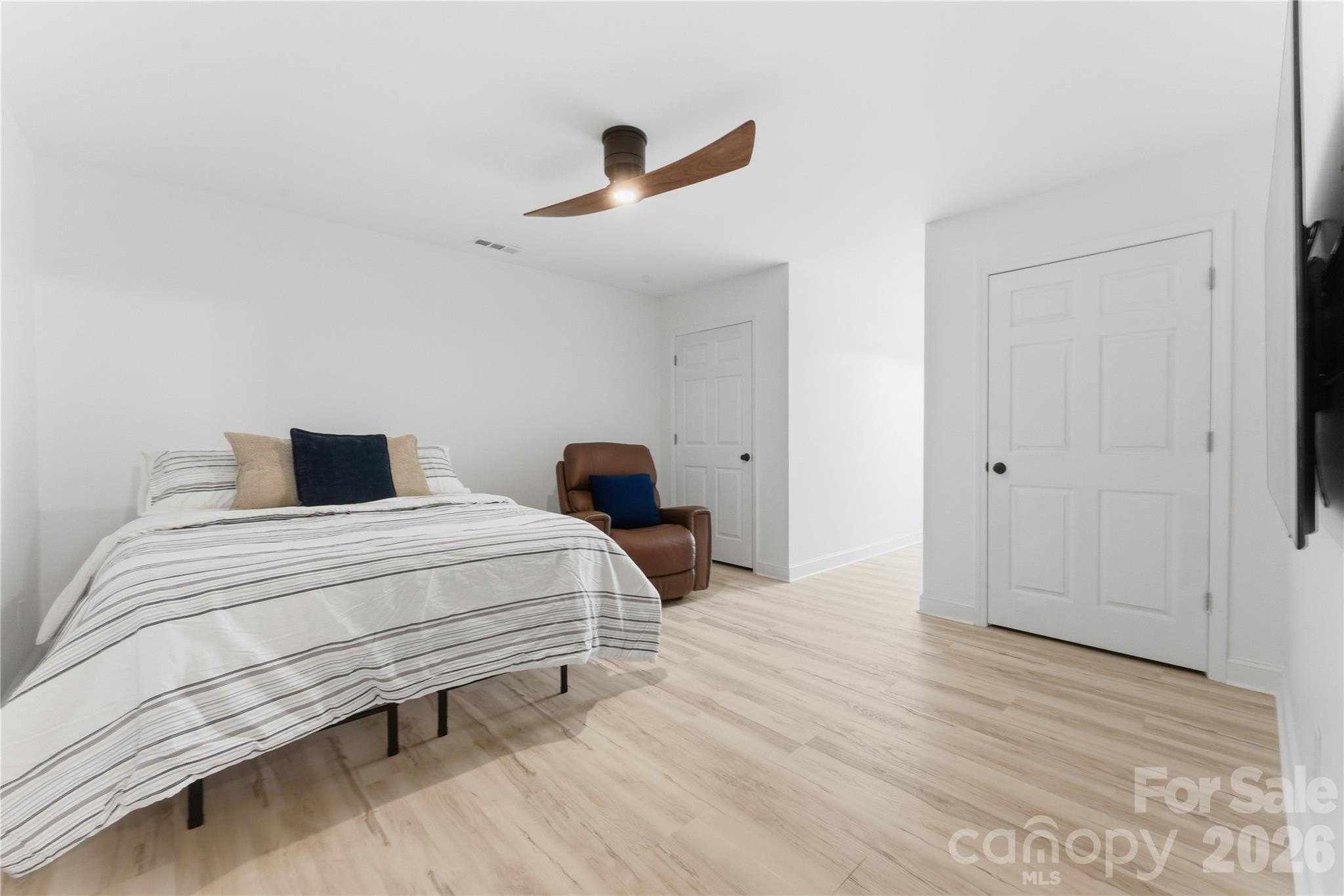 15 Raccoon Point Canton, NC 28716 - Photo 30 of 48 a bedroom with a bed and a ceiling fan