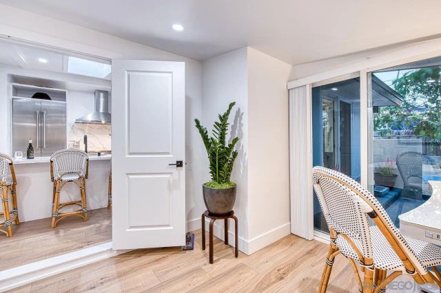 a view of a workspace with furniture and a potted plant