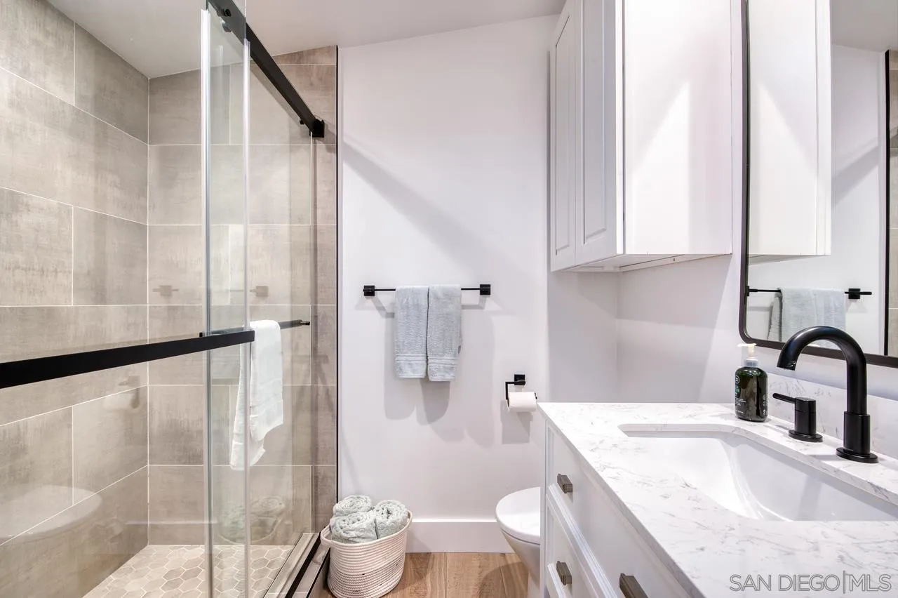 34082 La Serena Drive Dana Point, CA 92629 - Photo 17 of 43 a bathroom with a granite countertop sink a toilet and bathtub