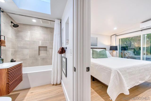 a bathroom with a tub and a shower