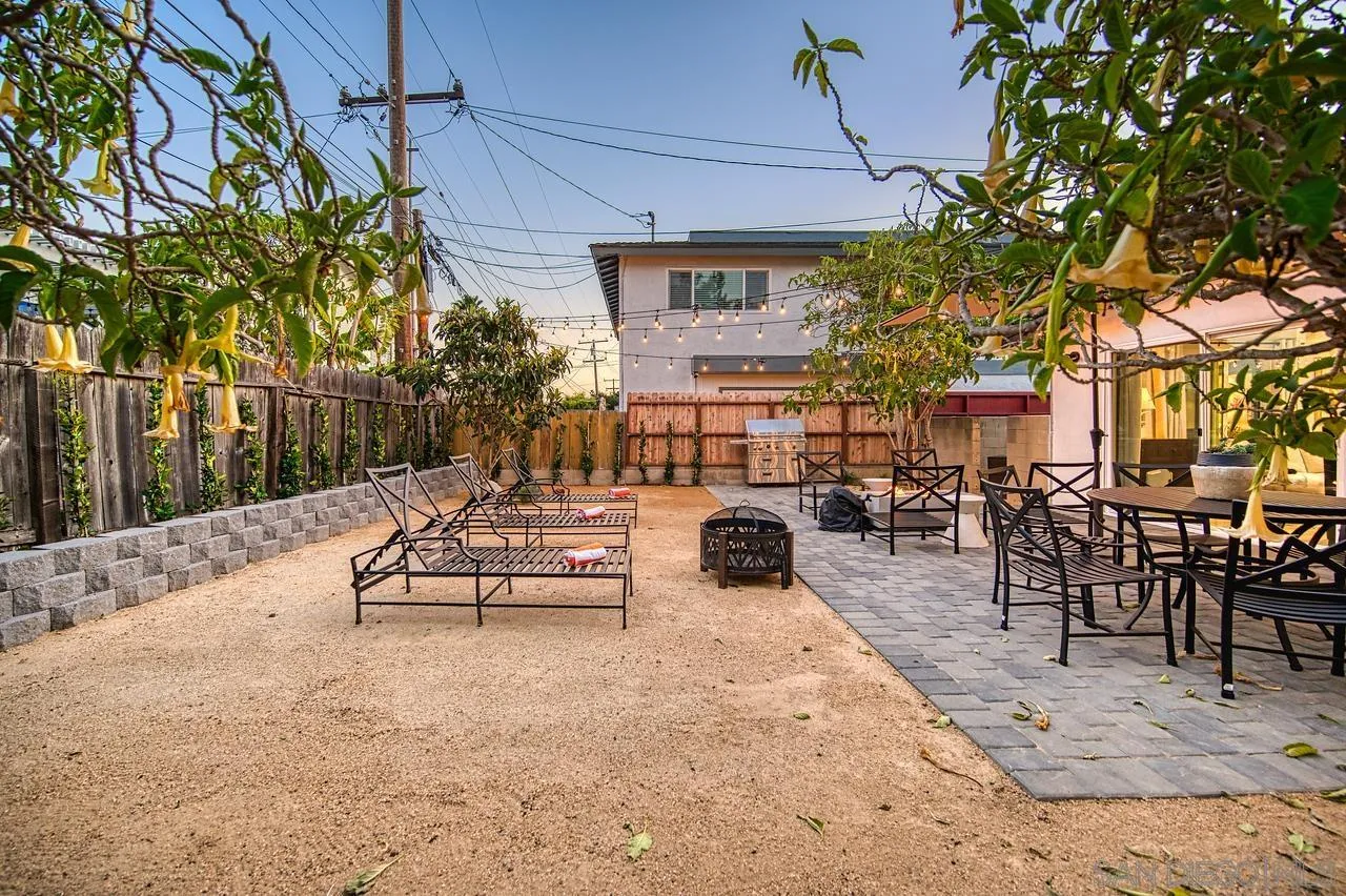 34082 La Serena Drive Dana Point, CA 92629 - Photo 28 of 43 a view of a patio with couches and table and chairs under an umbrella